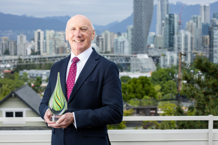 Paul Keown holding the award